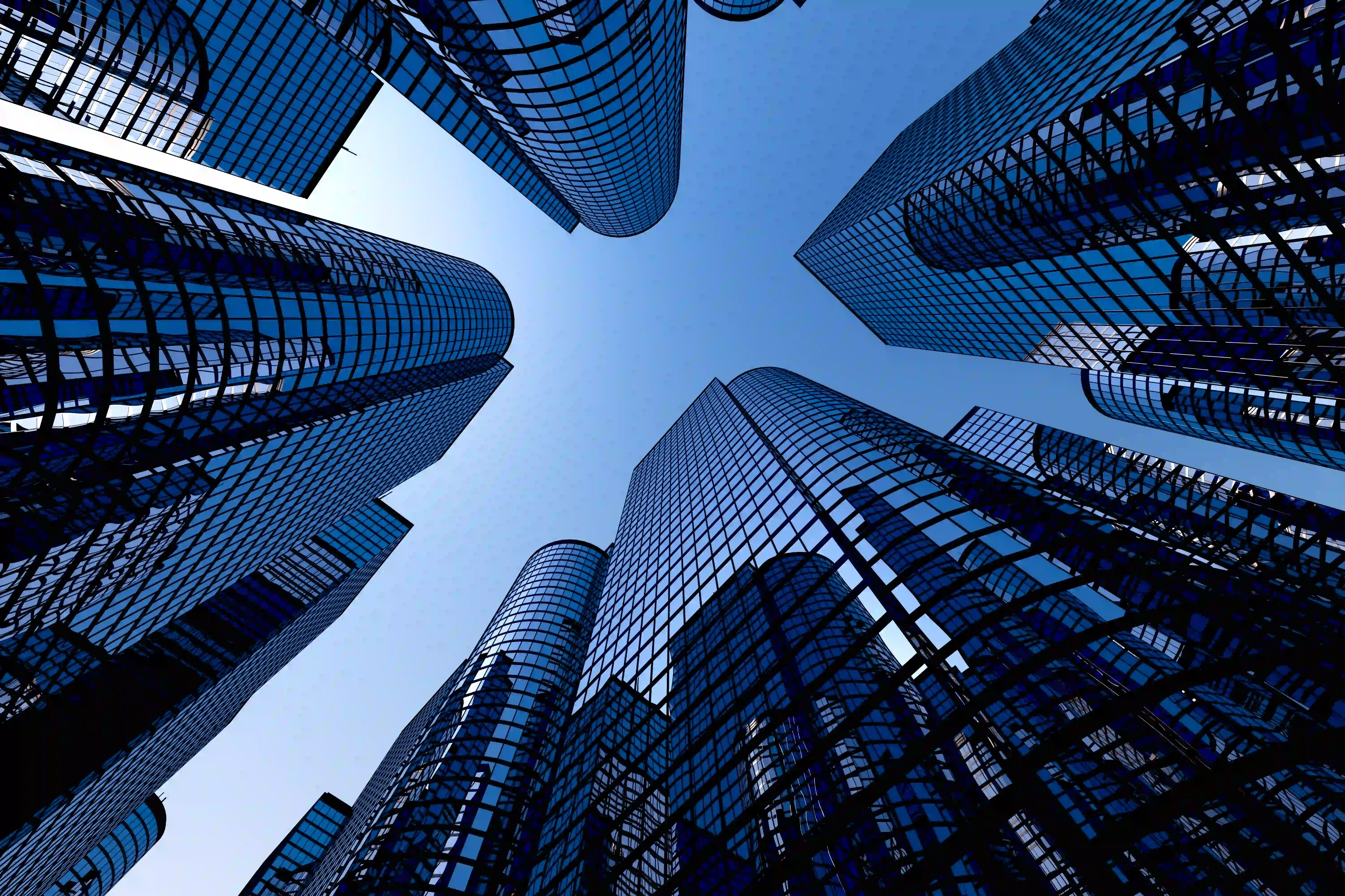 Ground perspective views multiple high rise buildings.